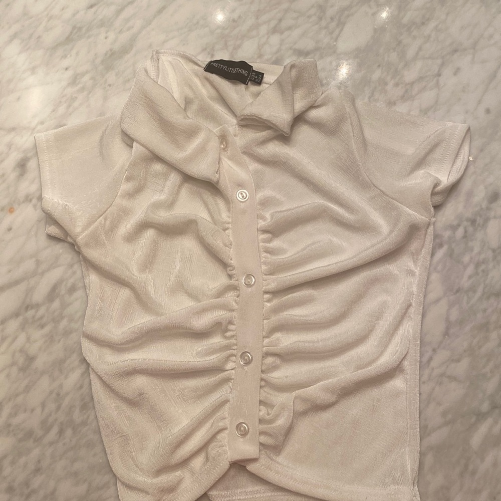 Pretty little thing white crop top!! In great condition never been worn.